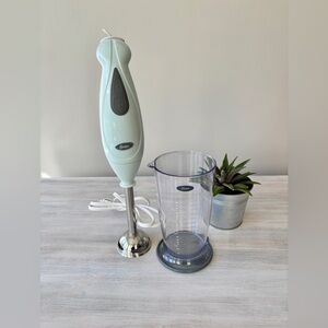 NWT Light Turquoise Oster Immersion Blender With Measuring Cup.